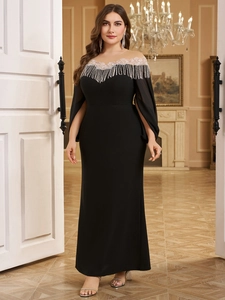 Close-up of golden lace neckline with beaded fringes on a black slim fit evening gown