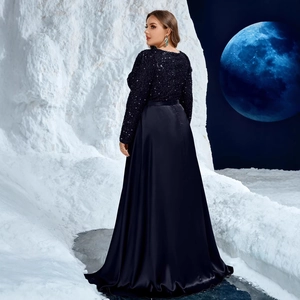 Midnight blue evening gown with sequined bodice and high-gloss satin skirt against moon backdrop