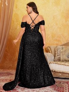 Detail of the back lace-up design and shimmering black sequins on the evening gown