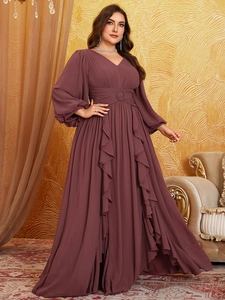 Detail view of V-neck chiffon evening dress with lantern sleeves and waist buckle