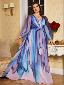 Detailed view of the V-neck and marble print chiffon fabric on this elegant maxi dress