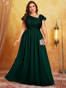 Detail of dark green plus size evening gown with sequin bodice and pleated long skirt