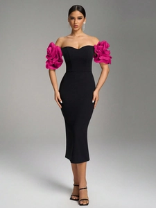 Detail of elegant off-shoulder black dress with oversized rose pink pleated ruffles