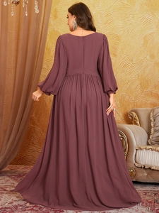 Rear view of a burgundy chiffon plus size maxi dress with elegant v-neck and lantern sleeves