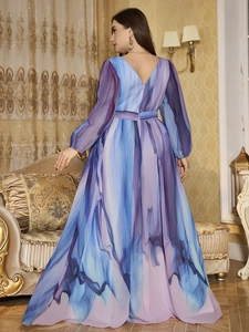 Detail of elegant V-neck chiffon evening gown featuring abstract marble print and long sleeves