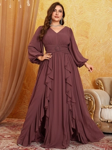 Detail of V-neck chiffon evening dress with lantern sleeves and ruffled long skirt