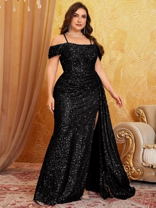Close-up of sparkling black sequins and side slit on the floor-length formal gown