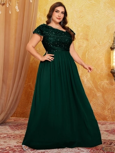 Detailed view of the dark green sequins and chiffon fabric on this formal evening gown