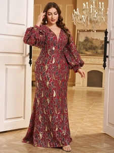 Detailed view of luxury red sequin embroidery and elegant lantern sleeves on a V-neck dress