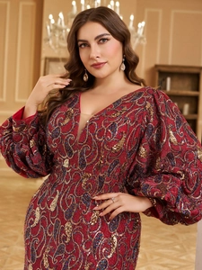 Close-up of elegant V-neck red dress with intricate sequin embroidery and lantern sleeves