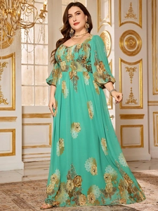 Detailed view of teal chiffon maxi dress with golden floral prints and lantern sleeves