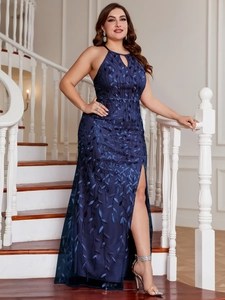 Detailed view of sequins on navy blue halter neck evening gown with elegant side split