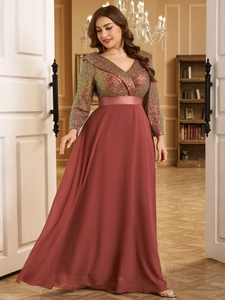Detail of rose pink V-neck evening gown featuring iridescent sequins and satin waistband