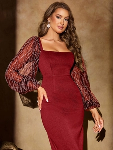 Detail of wine red dress featuring sequined sheer lantern sleeves and square neckline
