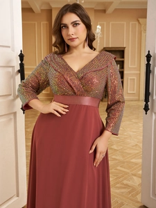 Detailed view of sequined V-neck bodice and long chiffon skirt on a red evening gown