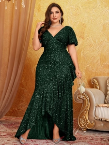 Detailed view of dark green sequin dress featuring layered ruffle hem and V-neckline