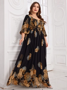 Detail of floral chiffon maxi dress with vintage gold flower pattern and square neckline