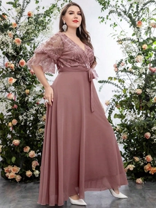 Detail of elegant V-neck lace embroidery and chiffon pleated skirt in dusty rose pink