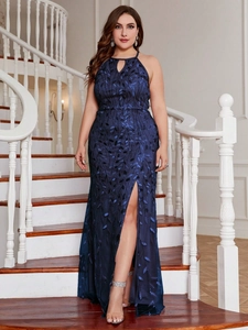 Detail of navy halter evening dress with leaf sequins, keyhole neck, and high side slit