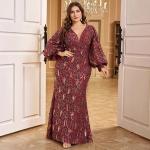 Elegant V-neck evening gown with red and gold sequins and lantern sleeves in long silhouette