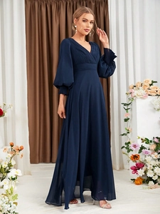 Detail of elegant V-neck bodice and long lantern sleeves on dark blue chiffon dress