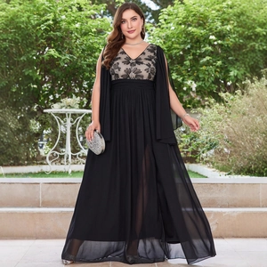 Detail of plus size black V-neck evening gown featuring elegant floral embroidery and sheer cape sleeves