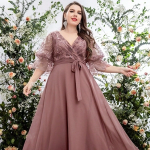 Detail of plus size evening dress with lace embroidery and ruffled sleeves in dusty rose