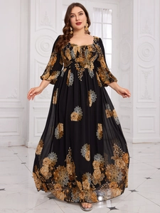 Detail of elegant black floral maxi dress with square neckline and chiffon puff sleeves