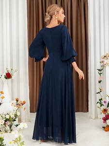 Detail of elegant navy blue V-neck chiffon evening gown showing the back and waist fit