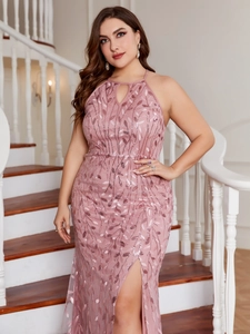 Detail of sequin leaf embroidery and high slit on a blush pink halter neck evening dress