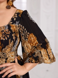 Detail of elegant lantern sleeves with floral print and pleated texture on chiffon dress