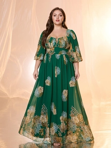 Detailed view of dark green chiffon maxi dress with elegant floral prints and sweetheart neck