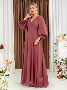Detail of rose pink V-neck chiffon evening gown with pleated waist and lantern sleeves