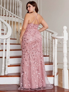 Detail of cross-back straps and sequins on this plus-size dusty pink evening gown