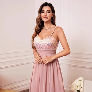 Detail of pink evening dress with sequins and elegant pleated waist design