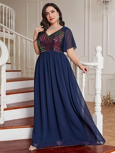 Detail view of navy blue plus size evening gown with sparkling sequin V-neck and chiffon sleeves