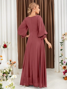 Detail view of the back zipper and pleated lantern sleeves on the dusty rose maxi dress