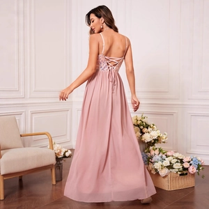 Pink spaghetti strap evening dress with sequin embroidery and a crisscross back detail