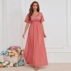 Close-up of pink sequined V-neck bodice and ruffled short sleeves on evening gown
