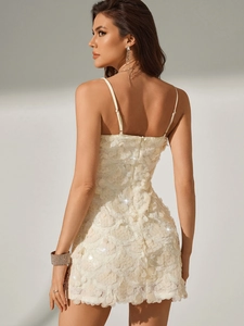 Elegant ivory sequin bodycon mini dress with delicate straps and layered petal design