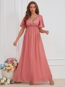 Detail of V-neck evening gown with shimmering sequins and flowing chiffon skirt