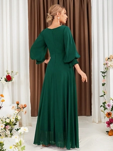 Detailed back view of a dark green V-neck evening dress with elegant lantern sleeves