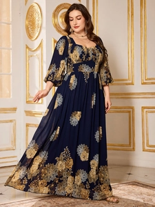 Detail of plus size navy chiffon dress with elegant yellow floral print and balloon sleeves