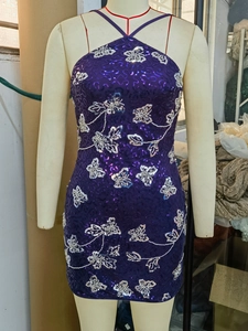 Purple sequin bodycon mini dress featuring silver butterfly embroidery and halter neck style