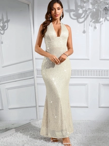 Detail of elegant backless sequin dress with deep V-neck and shimmering fishtail hem
