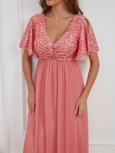 Detail of pink sequins on V-neck bodice with elegant chiffon maxi skirt design
