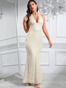 Close-up of white sequin backless mermaid dress with shimmering metallic texture