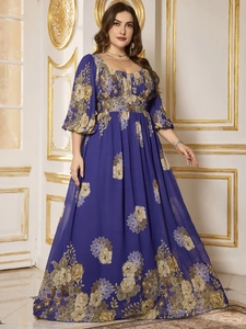 Detail of elegant plus size royal blue chiffon dress with floral prints and bubble sleeves