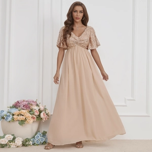 Detailed close-up of champagne V-neck evening gown with shimmering sequins and ruffles