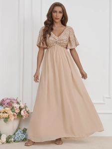 Detailed view of sequin bodice and flowing chiffon skirt on elegant V-neck gown
